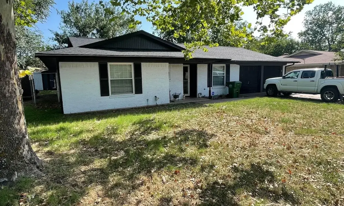 Professional roofing crew working on a residential roof in Homestead Meadows South
